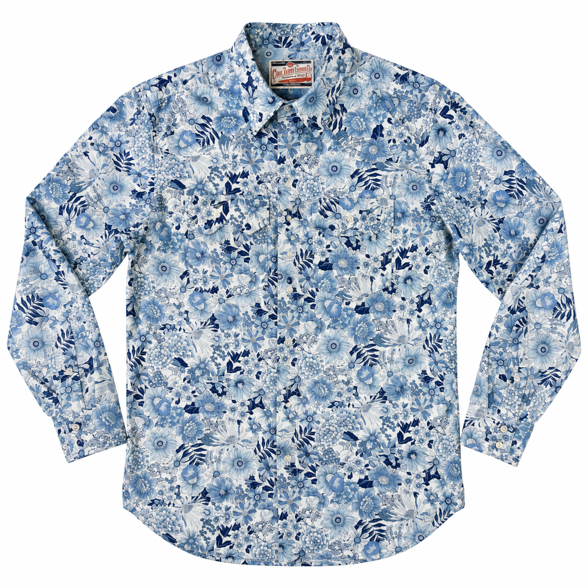 A long-sleeve button-up shirt with a dense blue and white floral and abstract pattern, laid flat against a white background.