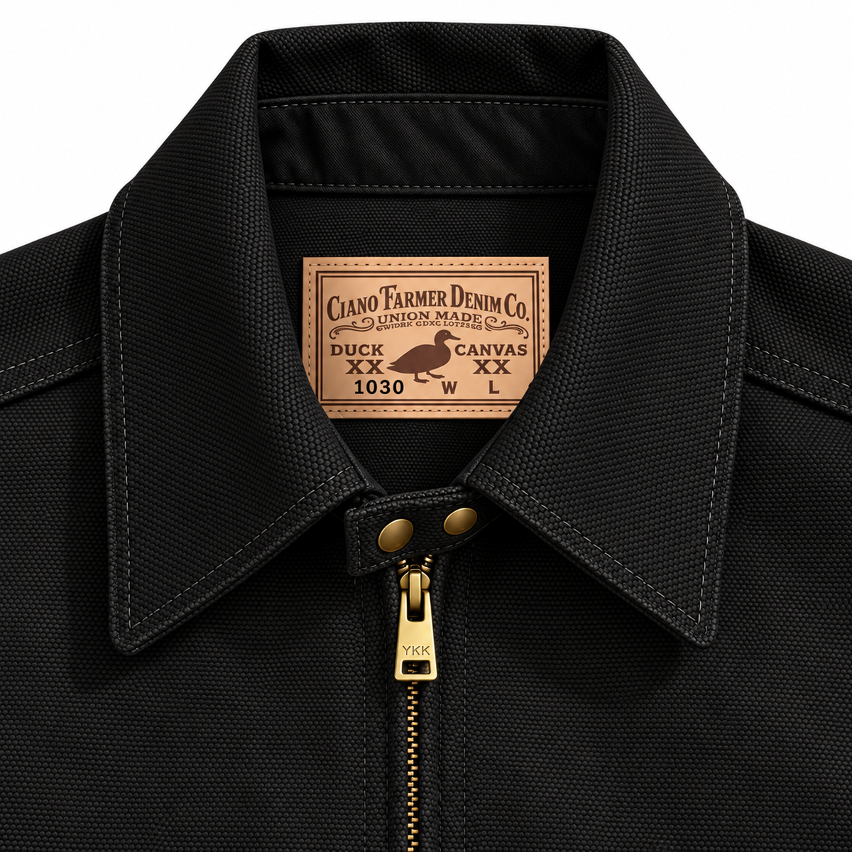 Close-up of a black textured canvas jacket collar with a brass zipper and a tan leather brand patch reading Ciano Farmer Denim Co.